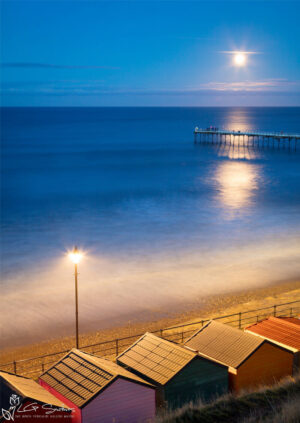 Moonrise Over Saltburn Pier And Beach Huts