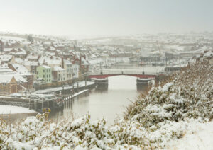 Snow Falling Over Whitby Harbour