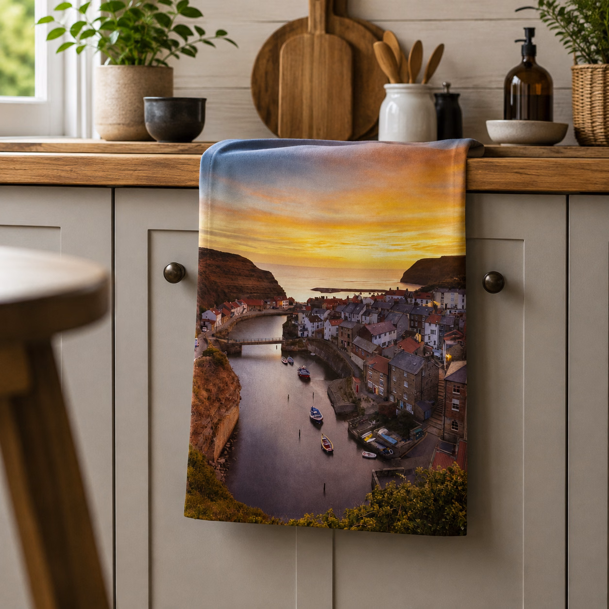 Staithes Tea Towel 2 Staithes sunset tea towel on display in a kitchen