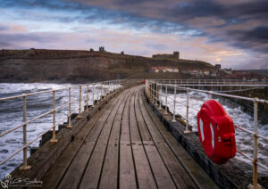 Whitby Piers In A Storm