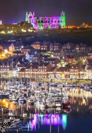 Illuminated Abbey Green And Purple Reflections Over The Whitby River Esk
