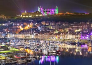 Illuminated Abbey Green and Purple Reflections Over The River Esk