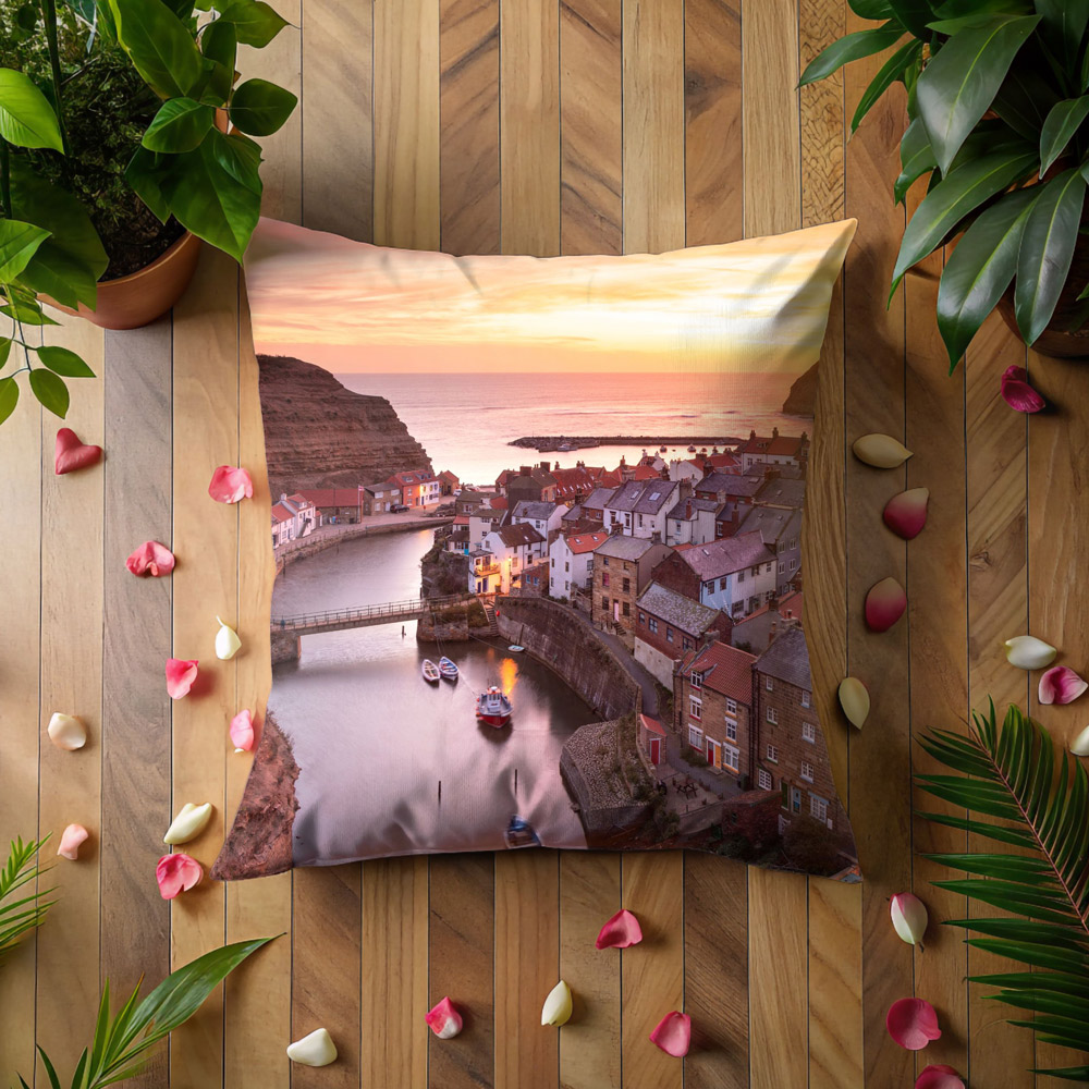 Staithes Sunrise Cushion On A Wooden Surface Staithes Sunrise Cushion On A Wooden Surface