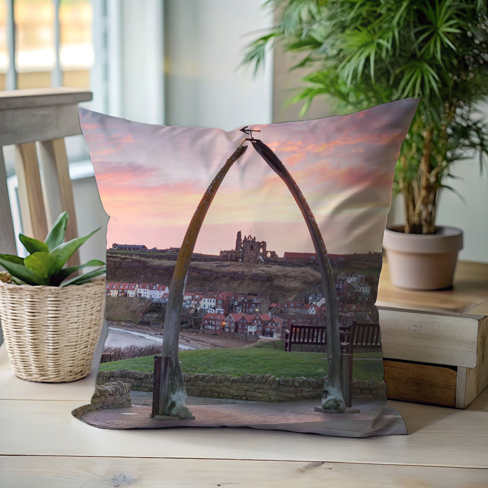 Whitby Cushion On Display Showing The Iconic Whalebones At Sunrise