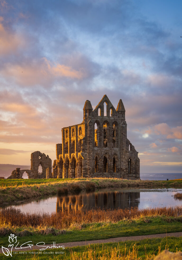 Golden Winter Sunset Reflecting Whitby Abbey In The Pond