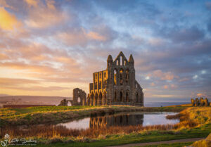 Whitby Abbey and Pond A Glow In A Winter Sunset
