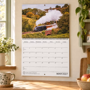 2027 NYMR steam trains calendar displayed in a cosy kitchen